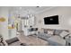Open floor plan with kitchen view from living room, showcasing modern design and a comfortable seating area at 3261 Fish Hawk Dr, Polk City, FL 33868
