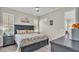 Serene main bedroom with a king bed, wood flooring, and a neutral color palette at 3261 Fish Hawk Dr, Polk City, FL 33868