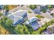 Aerial view of property showcasing a home, detached garage, and patterned brick driveway at 3287 Red Tail Hawk Dr, Polk City, FL 33868