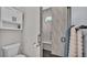 Bathroom featuring decorative shower with glass door, and cabinet at 3287 Red Tail Hawk Dr, Polk City, FL 33868