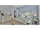 Serene bedroom with calming blue walls, a dresser, and comfortable bedding for relaxation at 3287 Red Tail Hawk Dr, Polk City, FL 33868
