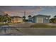 Charming blue home with guest house, garage, and paved driveway at 3287 Red Tail Hawk Dr, Polk City, FL 33868