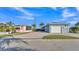 Charming blue home with guest house, garage, and paved driveway at 3287 Red Tail Hawk Dr, Polk City, FL 33868