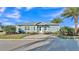 Charming home with landscaped front yard and circular driveway at 3287 Red Tail Hawk Dr, Polk City, FL 33868
