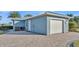 Lovely home featuring a garage, paved driveway, and meticulous landscaping at 3287 Red Tail Hawk Dr, Polk City, FL 33868
