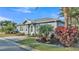 Charming single-story home with lush landscaping and well-maintained front yard at 3287 Red Tail Hawk Dr, Polk City, FL 33868