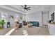 Inviting living room with natural light, comfortable seating, and contemporary decor at 3287 Red Tail Hawk Dr, Polk City, FL 33868