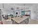 Open-concept living space features a large kitchen island, living room with fireplace, and an adjoining sitting room at 3287 Red Tail Hawk Dr, Polk City, FL 33868