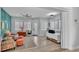 Bright sitting room with tile floors, several windows with shades, accent wall, and comfortable seating at 3287 Red Tail Hawk Dr, Polk City, FL 33868