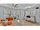 Bright sitting room with tile floors, windows with shades, and comfortable seating at 3287 Red Tail Hawk Dr, Polk City, FL 33868