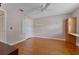 Large bedroom with light colored walls, wood floors, ceiling fan and closet at 3487 Highland Fairways Blvd, Lakeland, FL 33810