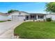 Charming single-story home featuring a well-maintained lawn, attached garage, and a cozy screened-in porch at 3487 Highland Fairways Blvd, Lakeland, FL 33810