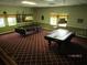 This game room features pool tables and comfortable lighting, perfect for entertaining guests at 3487 Highland Fairways Blvd, Lakeland, FL 33810