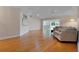 Bright living room with hardwood floors and a comfortable seating area bathed in natural light at 3487 Highland Fairways Blvd, Lakeland, FL 33810
