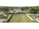 Aerial view of the property, showing a fenced yard with a patio area at 3568 Jade Ln, Mulberry, FL 33860