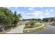 Aerial view of the home situated on a well-manicured lot with mature trees and landscaping at 3568 Jade Ln, Mulberry, FL 33860