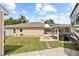 Well-kept backyard including screened in porch, fire pit, and RV parking at 3568 Jade Ln, Mulberry, FL 33860