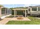 Outdoor fire pit and covered area in a well-maintained, spacious yard at 3568 Jade Ln, Mulberry, FL 33860