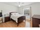 Comfortable bedroom featuring a wooden frame bed and natural light at 3568 Jade Ln, Mulberry, FL 33860