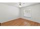 Clean bedroom featuring a window, ceiling fan, and wood floors at 3568 Jade Ln, Mulberry, FL 33860