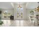 Bright foyer with double front doors, transom window, tile flooring, and open view to other living spaces at 3568 Jade Ln, Mulberry, FL 33860