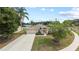 Inviting single-story home featuring an attached two-car garage, arched entry, and nicely landscaped front yard at 3568 Jade Ln, Mulberry, FL 33860