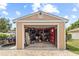 View of open garage packed with tools and equipment, ideal for hobbyists or mechanics at 3568 Jade Ln, Mulberry, FL 33860