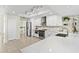 Bright kitchen with stainless steel appliances, a tile backsplash, and views to the dining area at 3568 Jade Ln, Mulberry, FL 33860