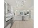 Updated kitchen with stainless steel appliances and views into the living room and backyard at 3568 Jade Ln, Mulberry, FL 33860
