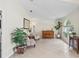Bright and airy living room featuring tile flooring, large windows, and ample space for seating at 3568 Jade Ln, Mulberry, FL 33860