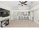 Open living room with views into the kitchen and an adjacent fireplace at 3568 Jade Ln, Mulberry, FL 33860