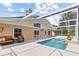 Enjoy outdoor living with the screened in pool, furniture and deck space at 3568 Jade Ln, Mulberry, FL 33860