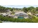 Home featuring a screened-in pool, an outdoor entertainment area, and fenced yard at 3568 Jade Ln, Mulberry, FL 33860