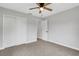 Bedroom boasts neutral carpet, closet and white doors for a clean, modern look at 3601 Avenue R Nw, Winter Haven, FL 33881