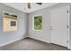 Bright bedroom features plush carpeting, a door to the exterior and lots of natural light at 3601 Avenue R Nw, Winter Haven, FL 33881