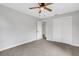Bedroom boasts neutral carpet, closet and white doors for a clean, modern look at 3601 Avenue R Nw, Winter Haven, FL 33881