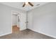 Bedroom boasts neutral carpet and white doors, with an open doorway to the kitchen at 3601 Avenue R Nw, Winter Haven, FL 33881
