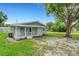 Inviting home with a spacious front porch and freshly landscaped garden beds, offering great curb appeal at 3601 Avenue R Nw, Winter Haven, FL 33881