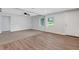 Bright and airy living room featuring wood flooring, carpet and fresh paint, offering a welcoming ambiance at 3601 Avenue R Nw, Winter Haven, FL 33881