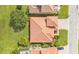 Aerial view features a tile roof, green grass and professional landscaping at 3980 Sunset Lake Dr, Lakeland, FL 33810