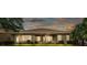 The backyard features green grass, exterior house view, and covered patio area at 3980 Sunset Lake Dr, Lakeland, FL 33810