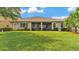 Lush green backyard with patio area, perfect for outdoor gatherings at 3980 Sunset Lake Dr, Lakeland, FL 33810