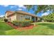Well-kept backyard with healthy landscaping, a tiled roof and mature trees at 3980 Sunset Lake Dr, Lakeland, FL 33810