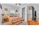 Cozy bedroom with neutral walls, soft carpet, and open closet space at 3980 Sunset Lake Dr, Lakeland, FL 33810