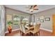 Beautiful dining room featuring seating for six, a ceiling fan and lots of natural light at 3980 Sunset Lake Dr, Lakeland, FL 33810