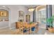 Dining room with large window, beautiful furniture, and adjacent to a hallway and living room at 3980 Sunset Lake Dr, Lakeland, FL 33810