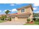This exterior elevation showcases a three car garage with a tile roof at 3980 Sunset Lake Dr, Lakeland, FL 33810