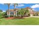 Beautiful home featuring a well maintained yard, green grass and manicured landscaping at 3980 Sunset Lake Dr, Lakeland, FL 33810