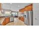 Kitchen with stainless appliances and granite countertops adjacent to the dining room seating six at 3980 Sunset Lake Dr, Lakeland, FL 33810