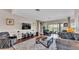 Inviting living room with a large flat-screen TV, comfortable seating, and stylish decor at 3980 Sunset Lake Dr, Lakeland, FL 33810